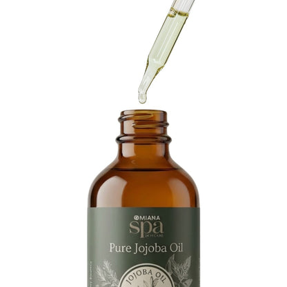 Bottle of Pure Jojoba Oil with dropper on a white background | Omiana Spa